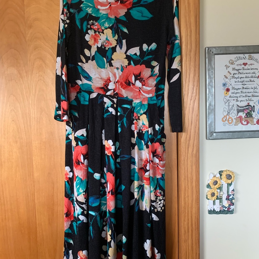 Reb & J Black flowered knit dress with 3/4 sleeves.
